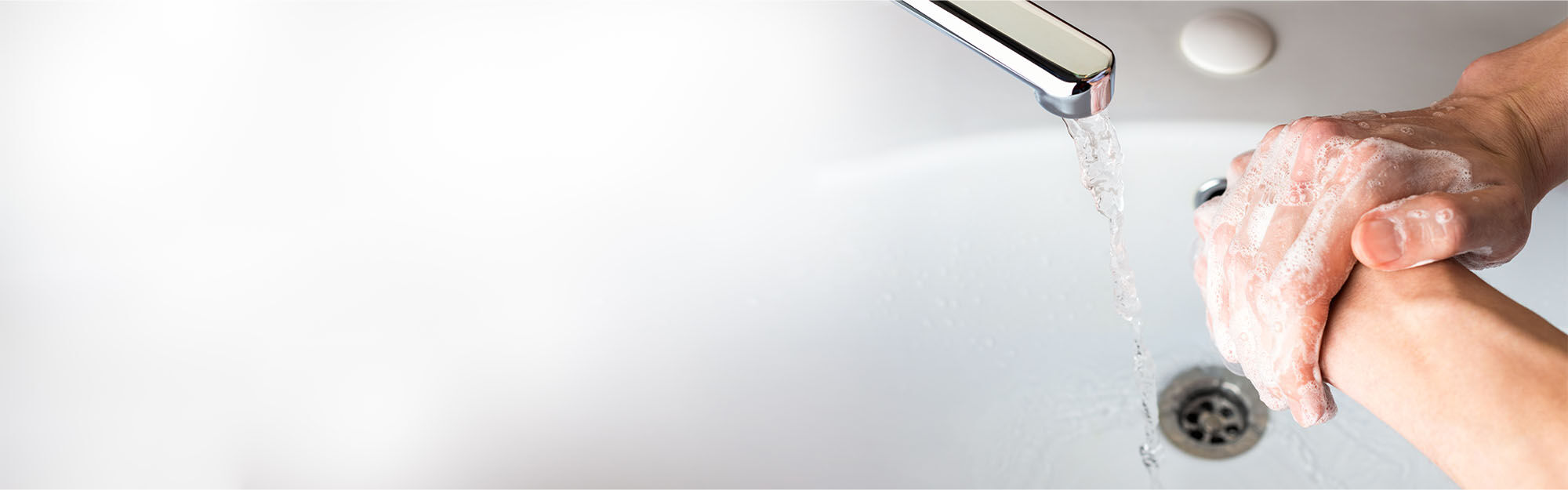 washing hands at sink