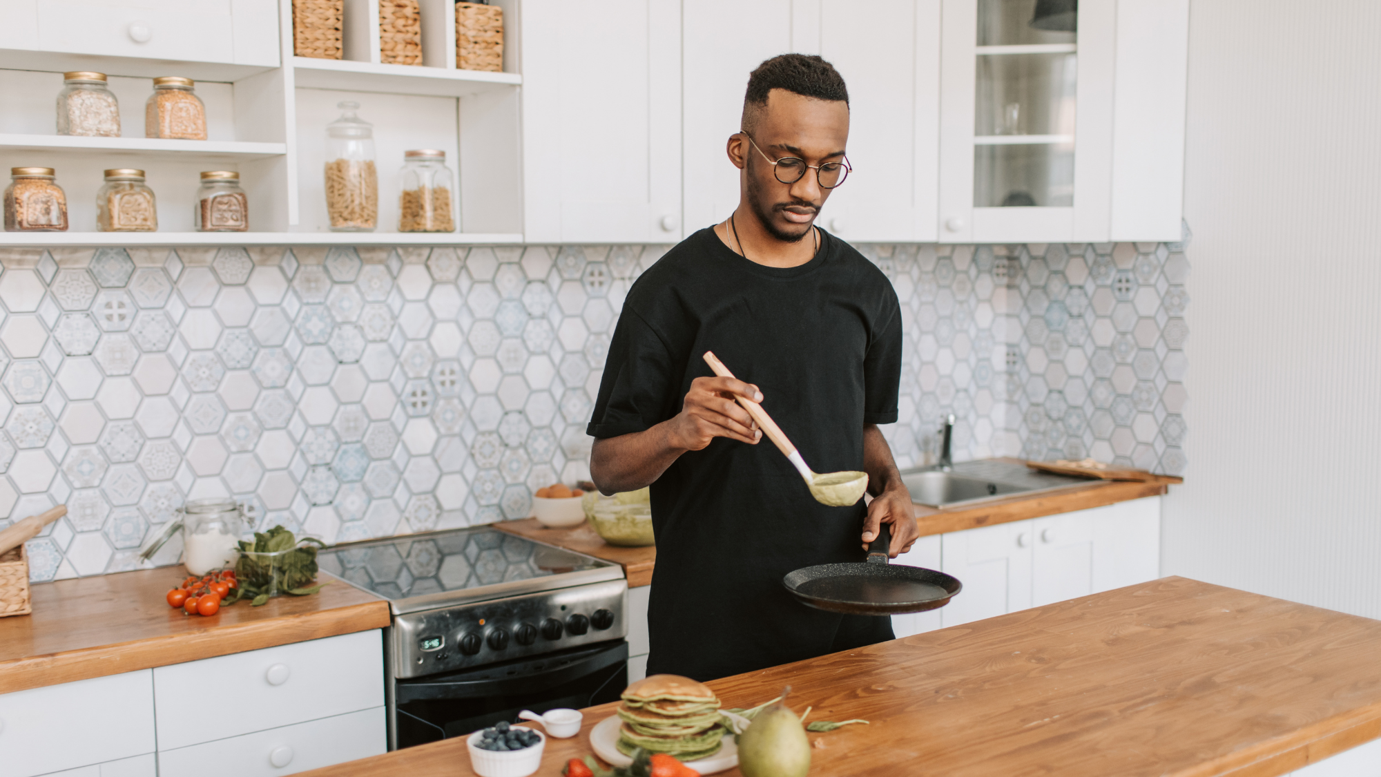man cooking in kitchen