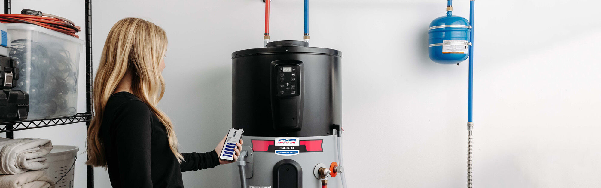 man washing dishes at sink